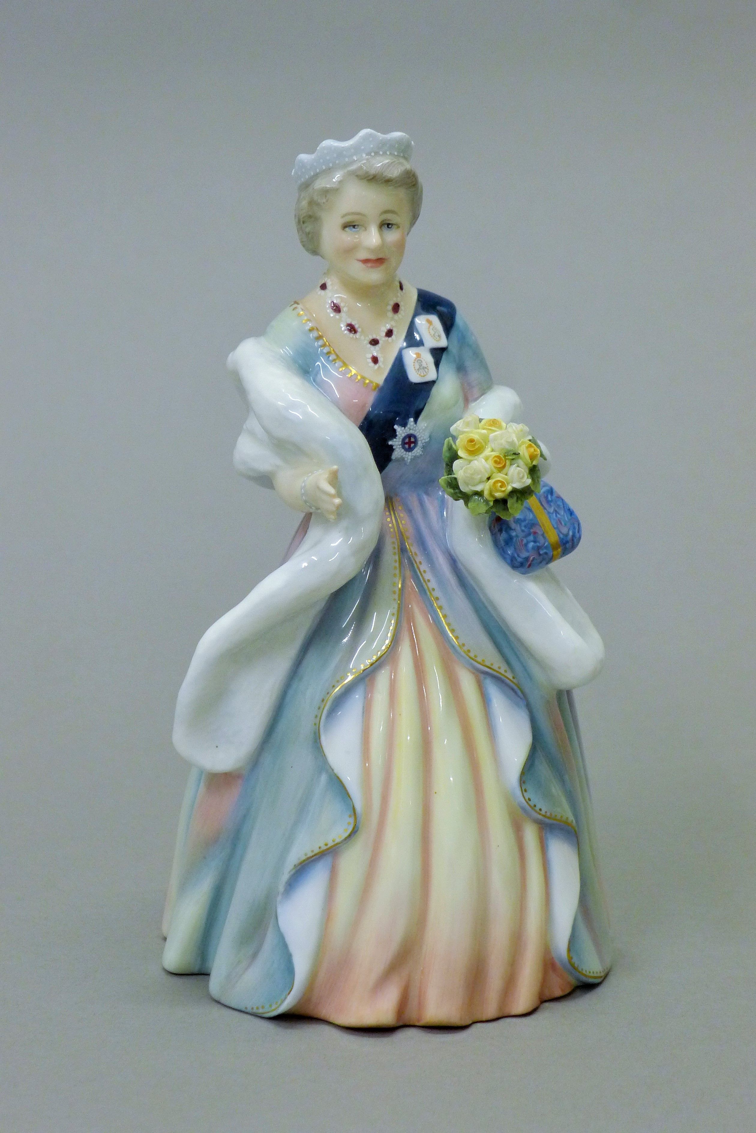 A Royal Doulton figurine, HM Queen Elizabeth The Queen Mother, HN3189. 20 cm high.