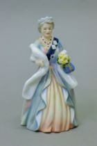 A Royal Doulton figurine, HM Queen Elizabeth The Queen Mother, HN3189. 20 cm high.