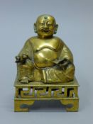 A 19th century bronze seated Buddha censer. 21.5 cm high.
