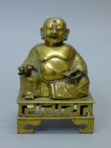 A 19th century bronze seated Buddha censer. 21.5 cm high.
