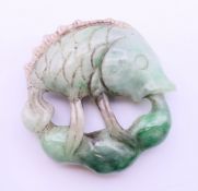 A jade carving of a fish. 5.5 cm diameter.