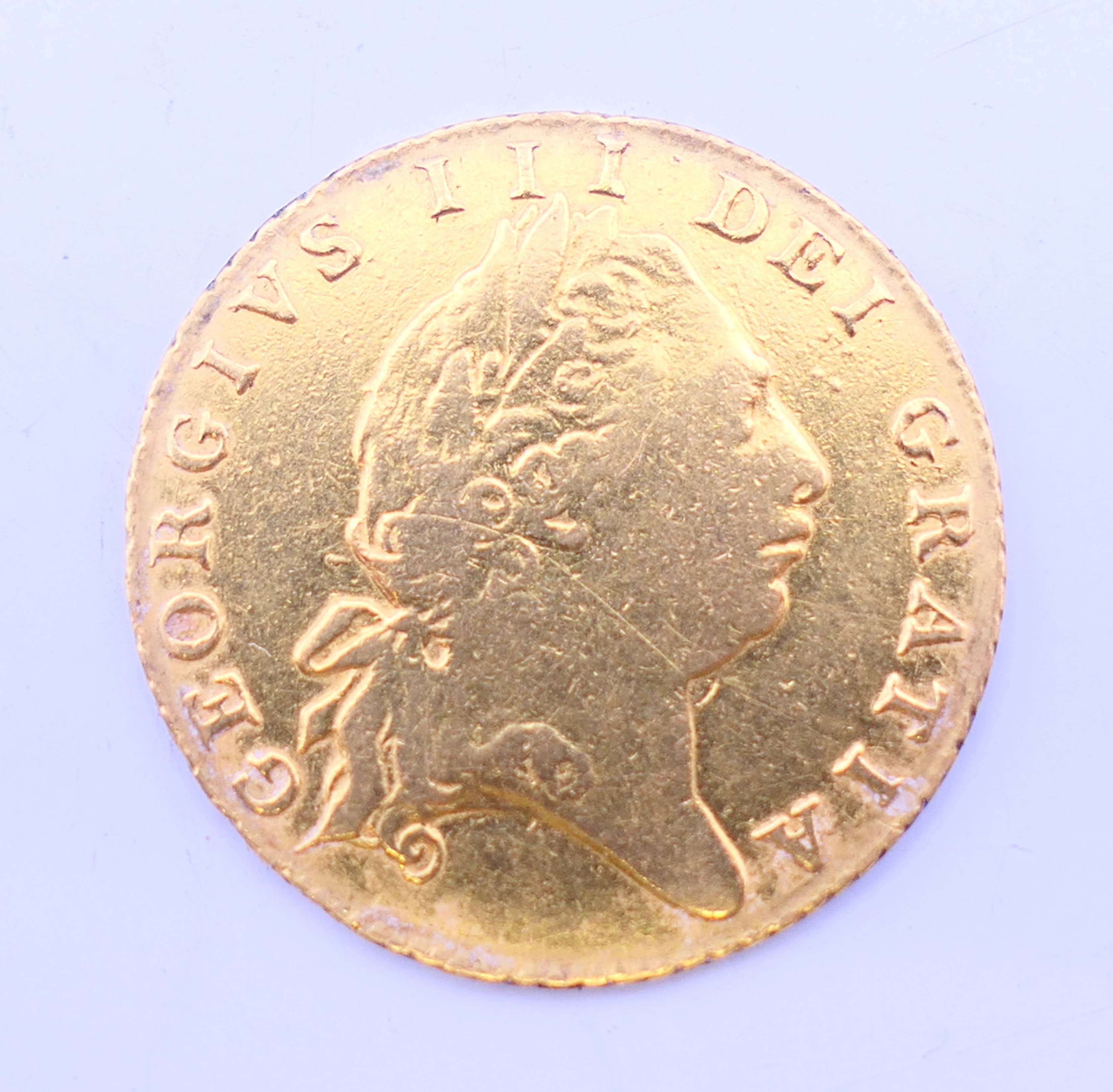An 1802 gold half guinea. 4.2 grammes.