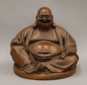 A seated model of Buddha. 30 cm high.