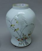 A 19th century Chinese porcelain ginger jar decorated with birds (lacking lid). 36 cm high.