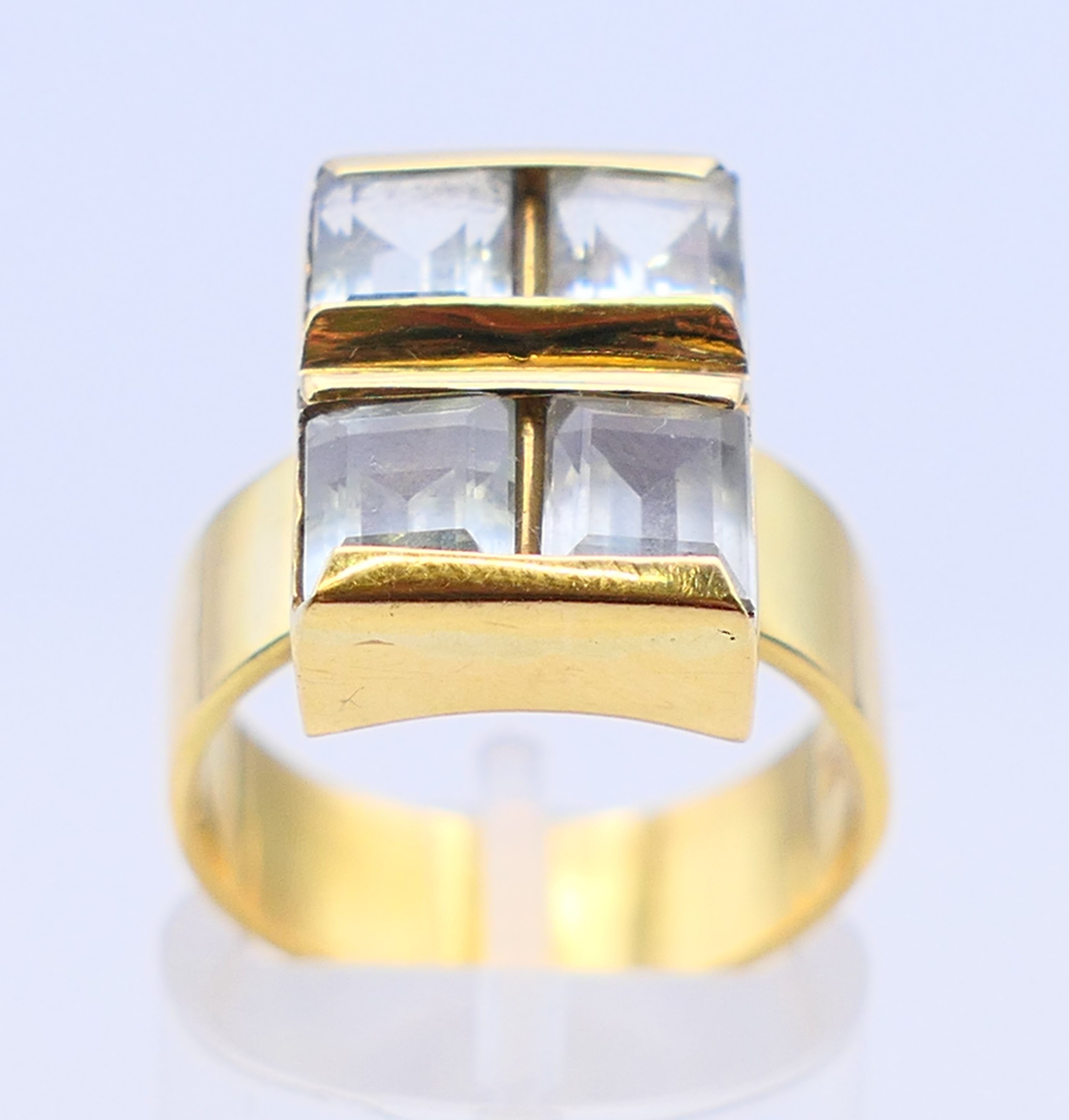 An 18 ct gold, aquamarine four stone ring, the emerald cut aquamarines 6 x 5mm x 3.9mm. Ring size O. - Image 2 of 7