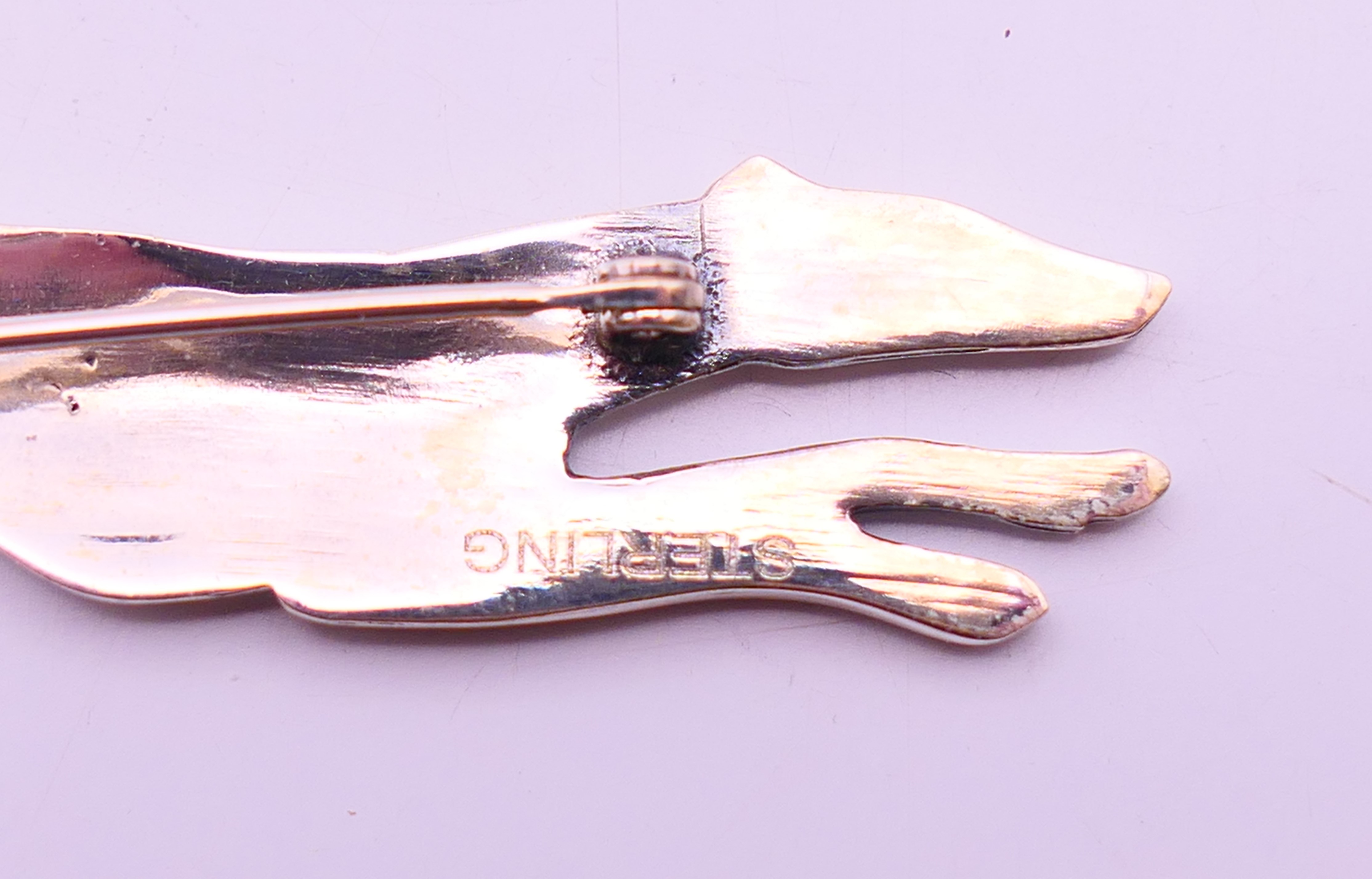 A silver brooch in the form of a greyhound. 7 cm long. - Image 4 of 4