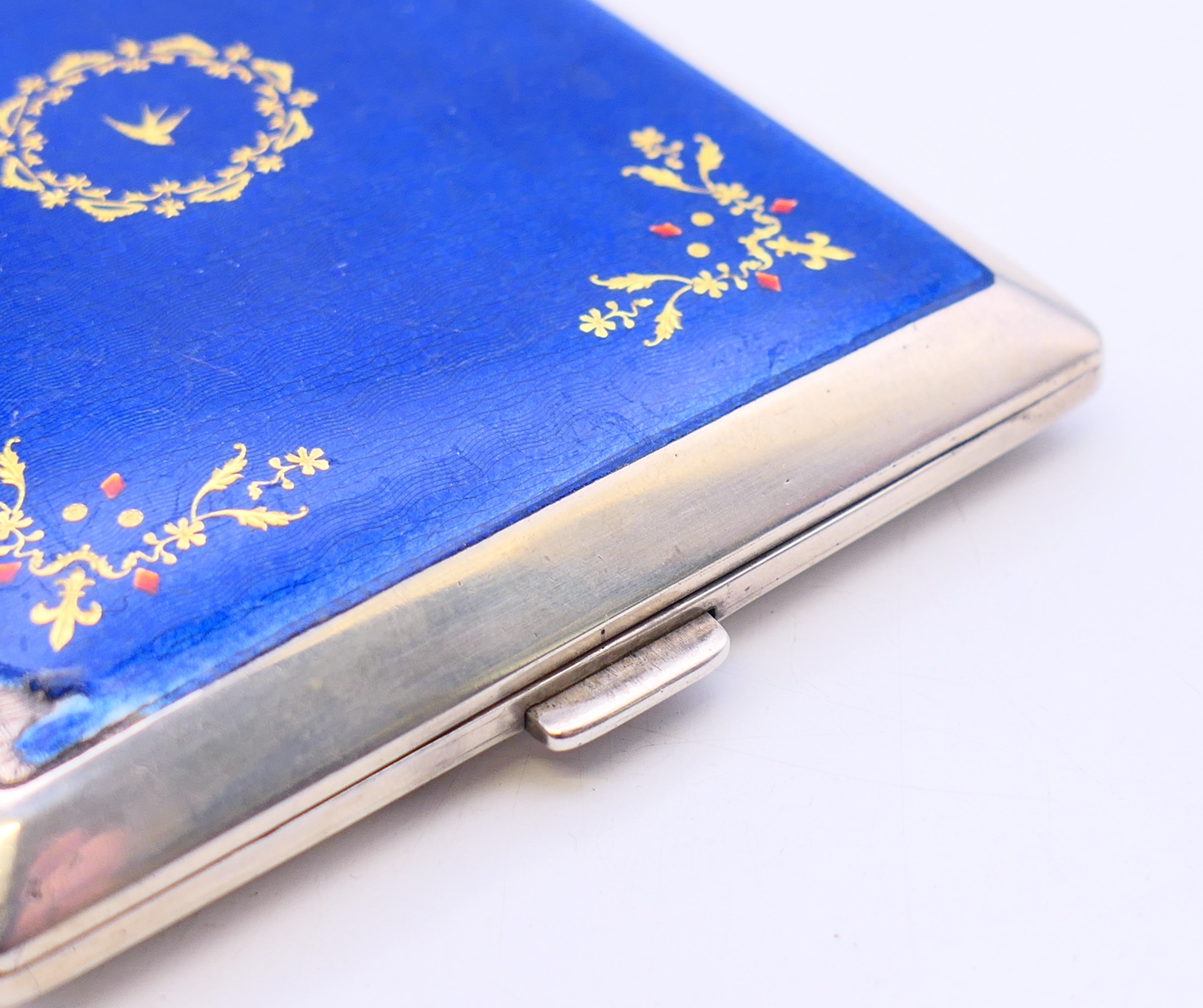 A continental silver and blue enamel cigarette case. 10 cm x 8 cm. - Image 3 of 8