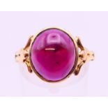 An antique unmarked 18 ct gold cabochon garnet ring. 4.5 grammes Ring size O.