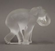 A Lalique glass elephant. 7 cm high.