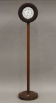 A Victorian mahogany clock and barometer on stand. 107.5 cm high.