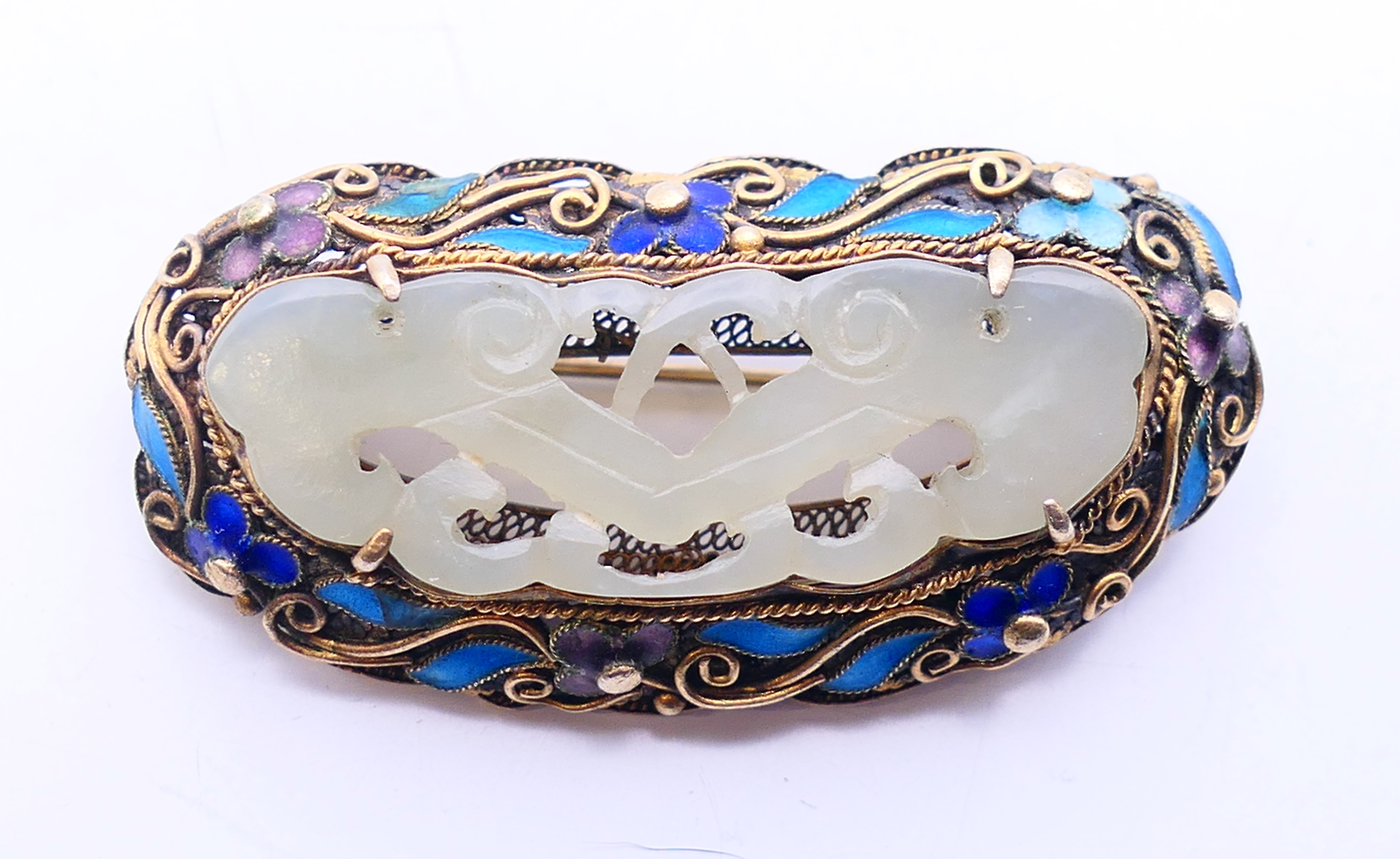 A Chinese silver, enamel and jade brooch. 5 cm x 2.5 cm.