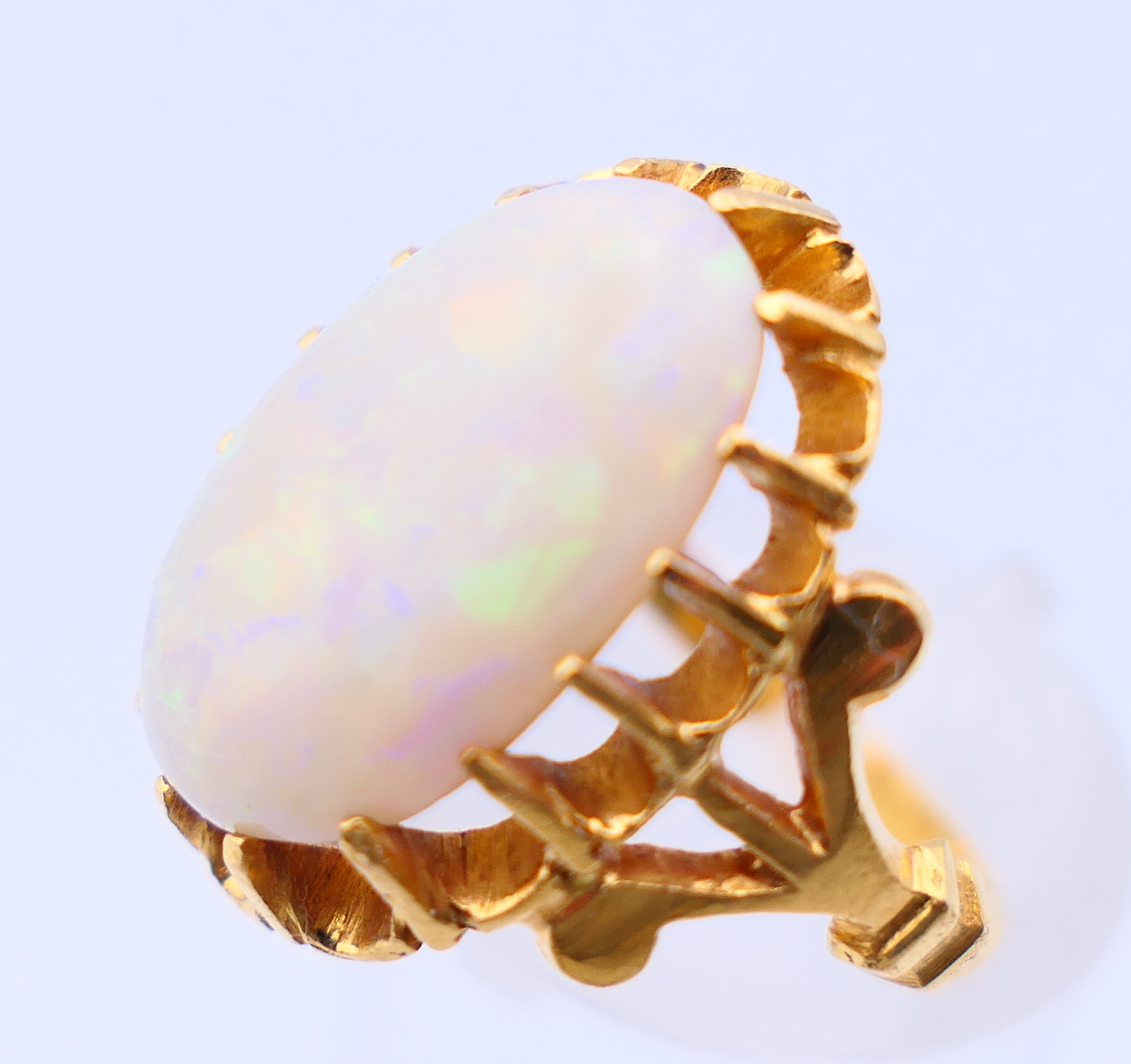 An unmarked 22 ct gold and opal ring. Ring size J. - Image 4 of 5