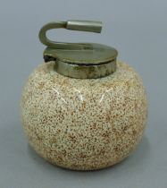 An inkwell in the form of a curling stone. 6 cm diameter.