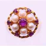 A 9 ct gold, pearl and ruby cluster ring. Ring size M.