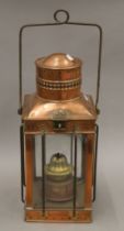 A copper lantern. 3805 cm high excluding handle.