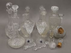 Various cut glass decanters, etc. The largest 35 cm high.