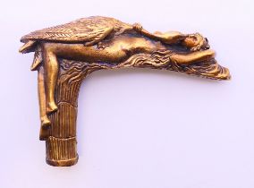 A bronze walking stick handle decorated with Leda and the swan design. 7 cm high, 10 cm long.