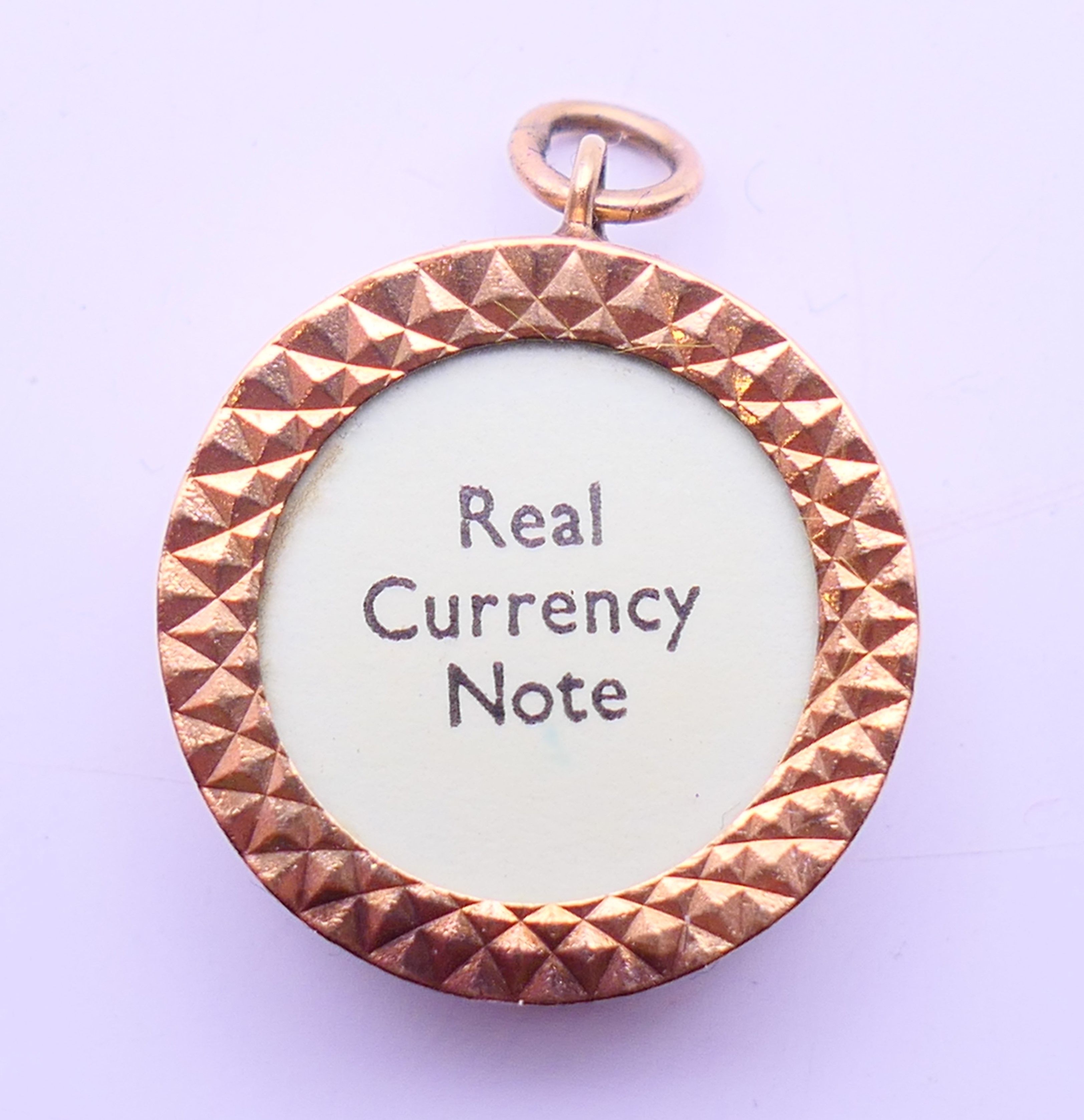 A 9 ct gold £1 note charm. 2 cm diameter. - Image 5 of 5