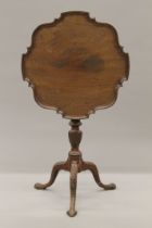 A 19th century mahogany pie crust tilt top tripod table. 53 cm wide.
