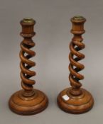 A pair of barley twist wooden candlesticks. 29.5 cm high.