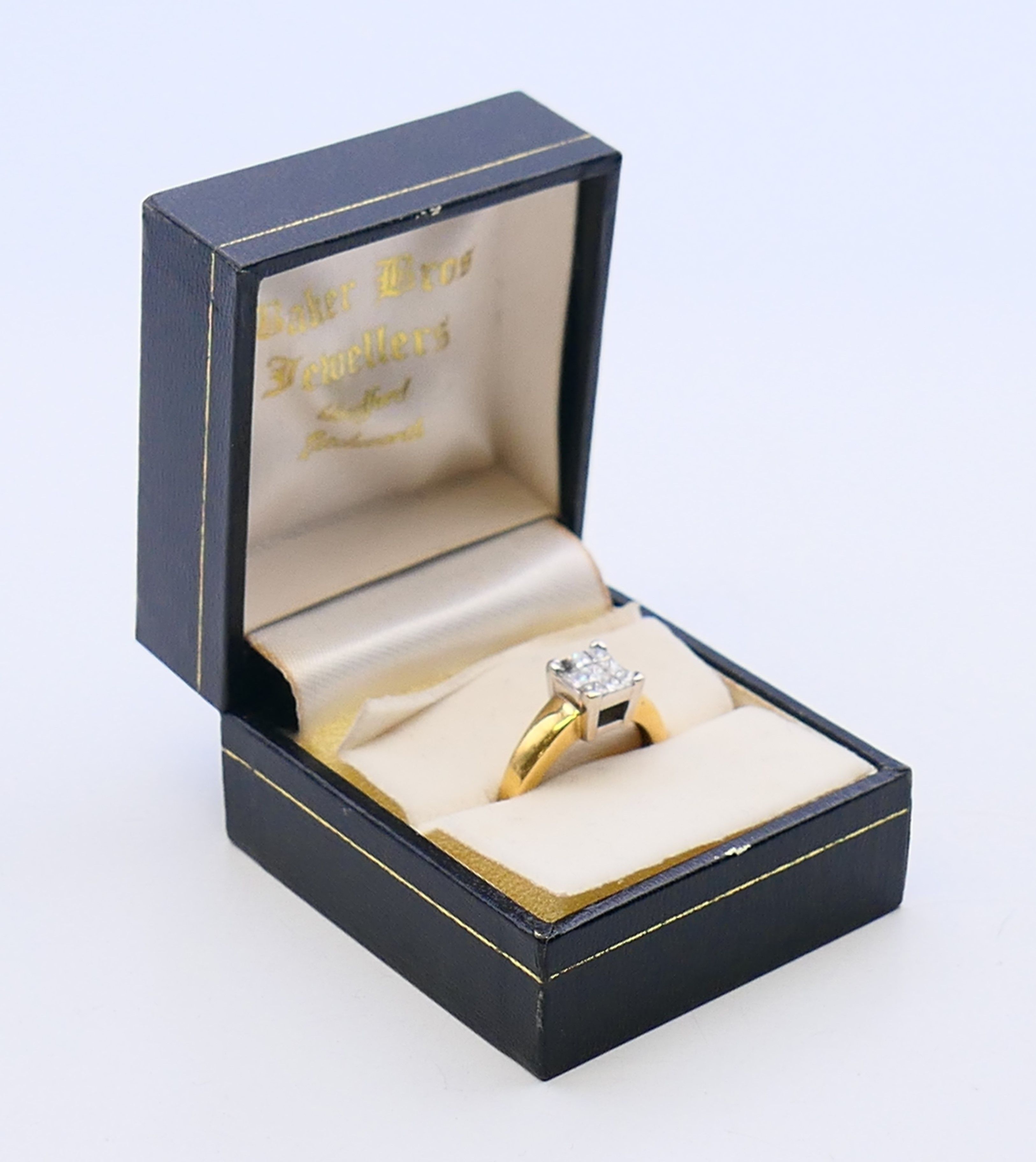 An 18 ct gold ring set with nine diamonds. together with a copy of a 2012 insurance valuation. - Image 8 of 8