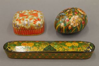 Three handmade Kashmiri papier mache boxes. The largest 21 cm long.