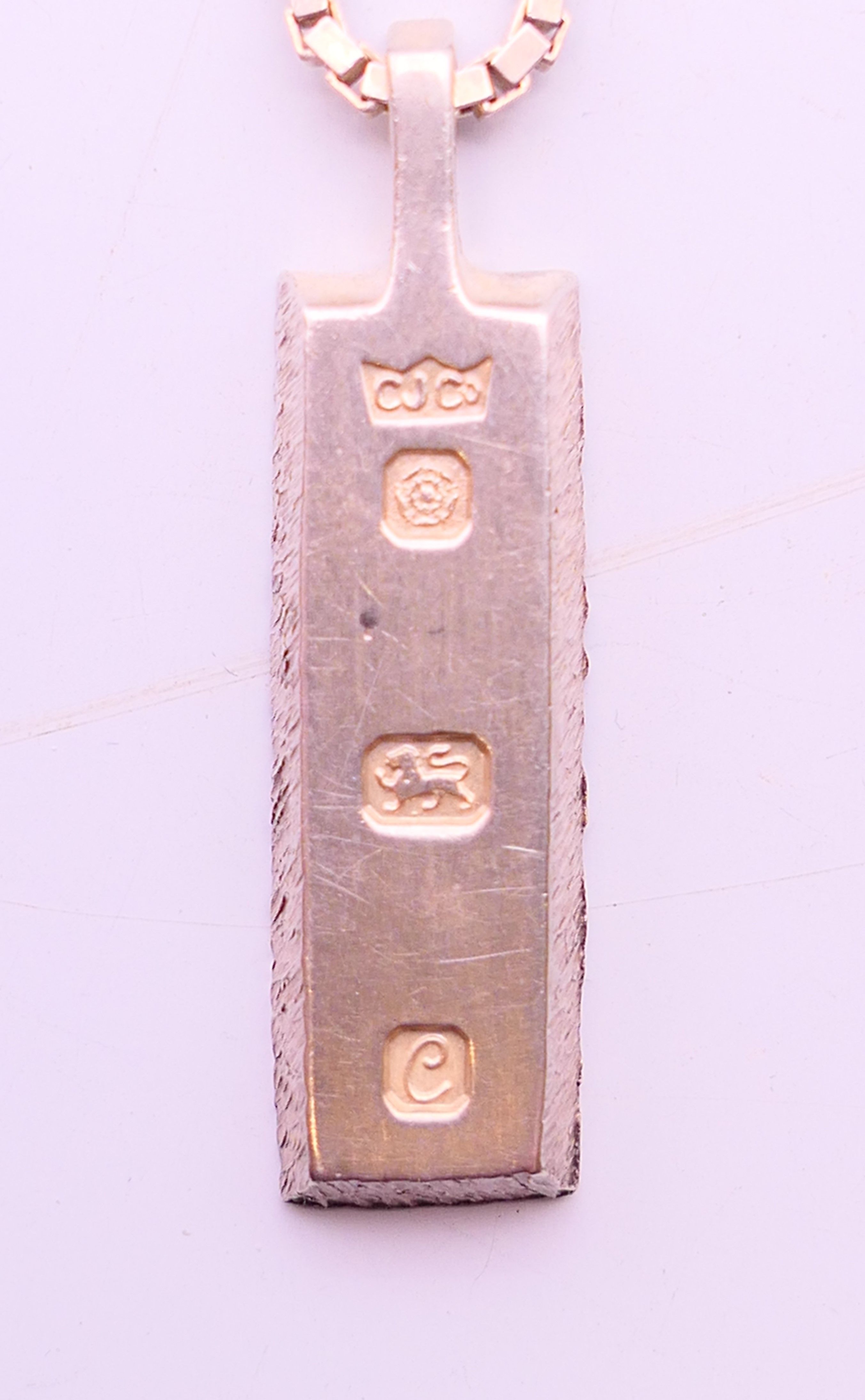 A silver ingot-style pendant, hallmarked on reverse and a silver chain stamped 925. Ingot 2. - Image 6 of 6