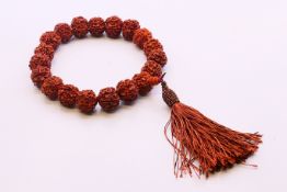 A Chinese string of worry beads. Approximately 30 cm long.