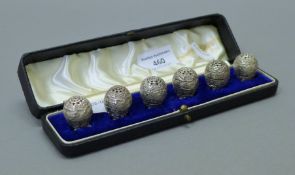 A set of six antique unmarked Indian egg-shaped cruets, in a fitted box. The box 20 cm long.