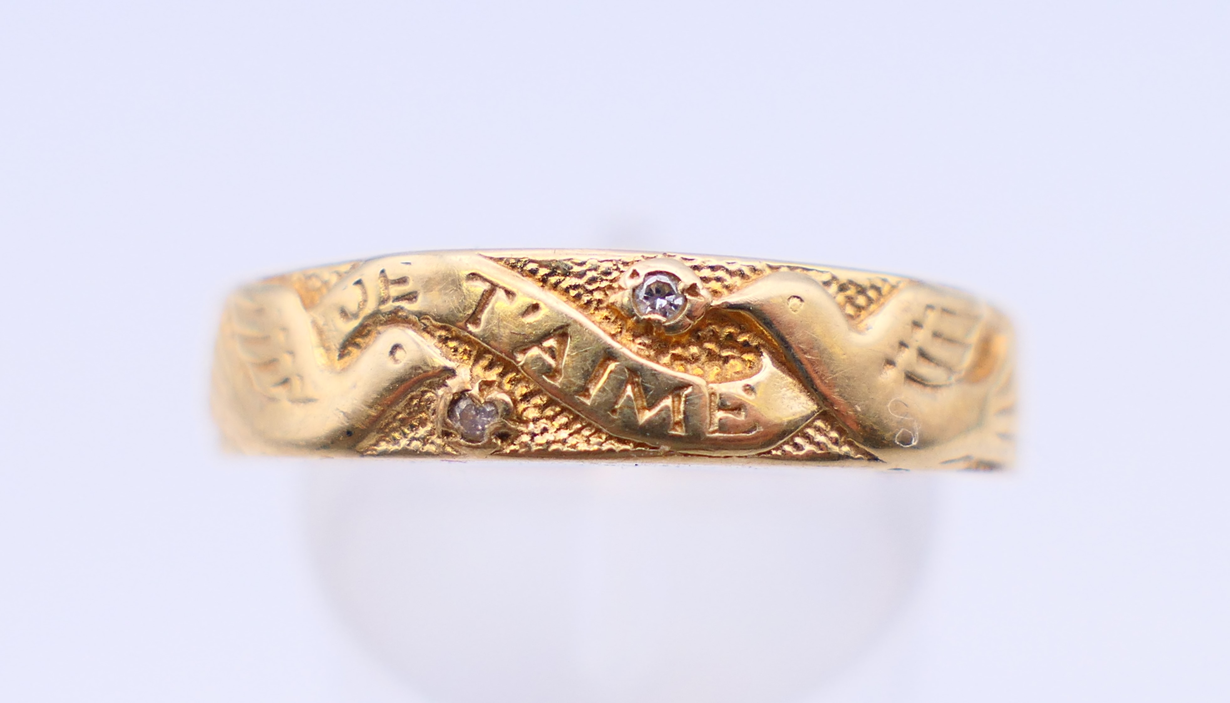 A 9 ct gold and diamond ring with two doves and marked Je T'aime. Ring size Q/R. - Image 2 of 10