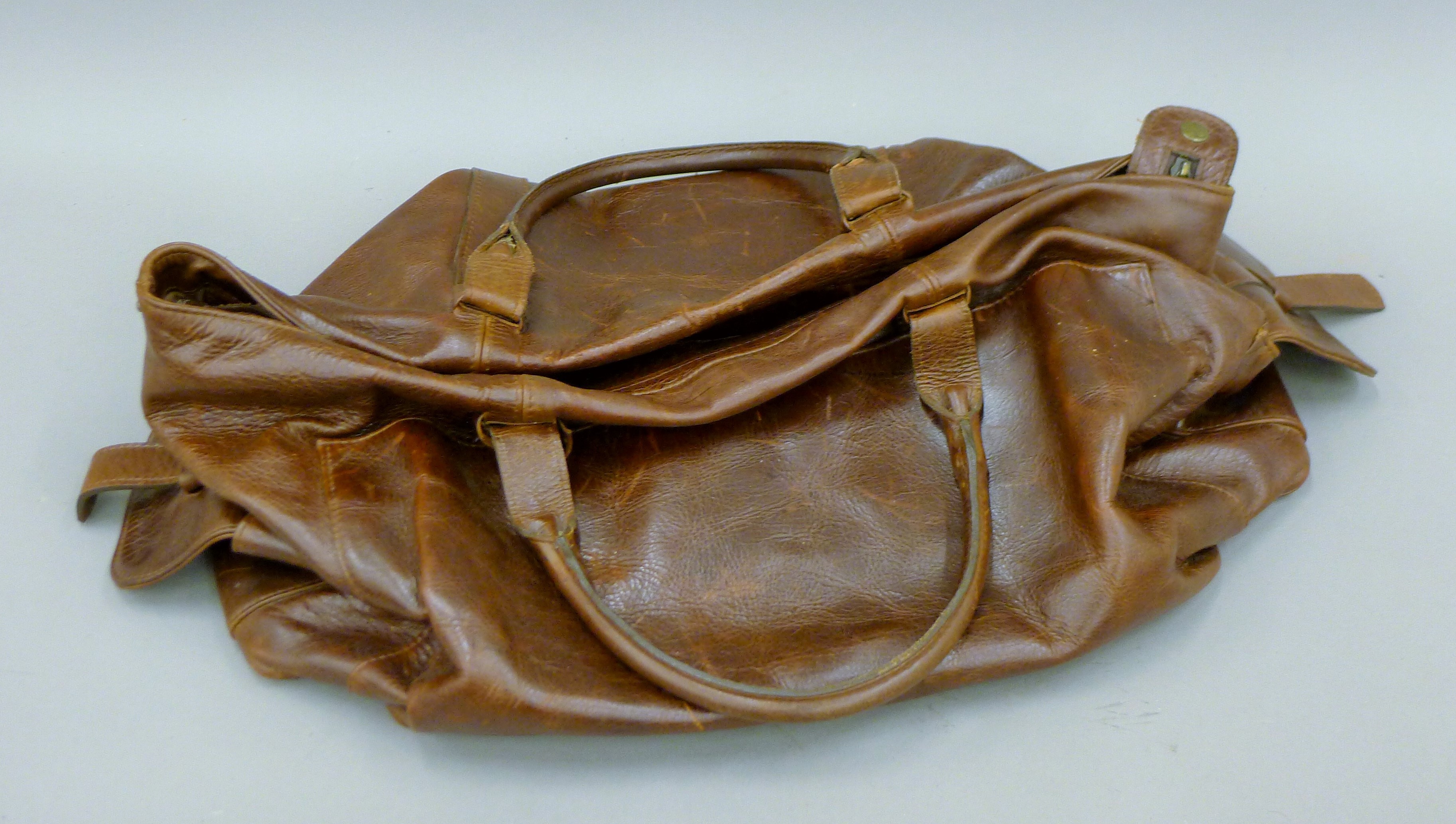 A vintage leather bag. 53 cms long.