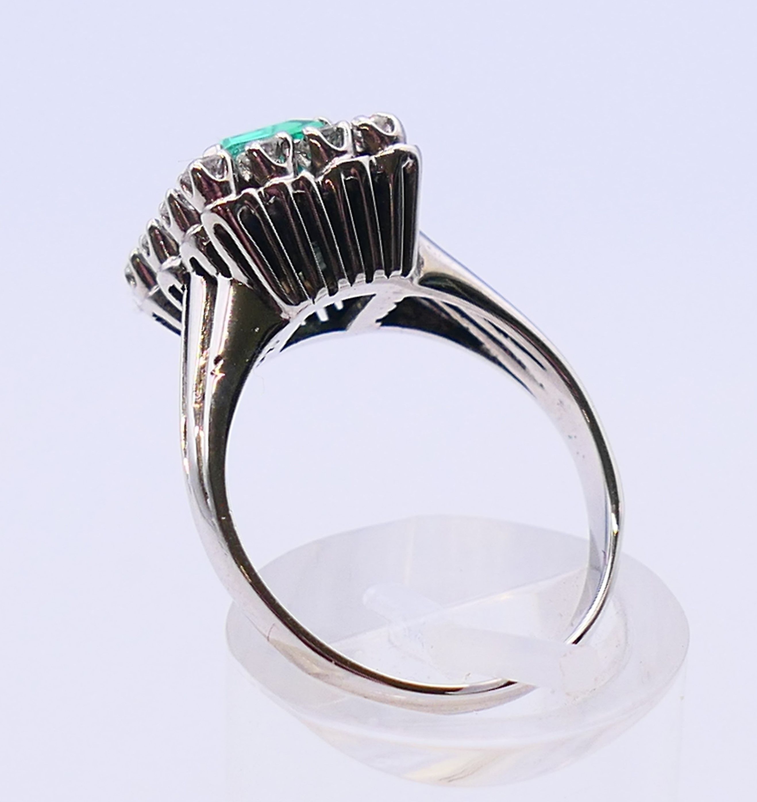 An unmarked 18 ct white gold, emerald and diamond ring. Ring size N/O. - Image 5 of 6