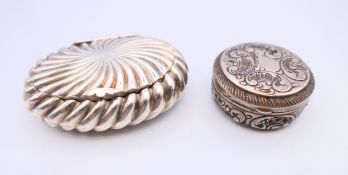 Two small silver snuff boxes. The largest 6 cm x 4.5 cm.