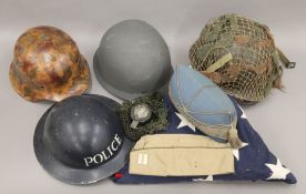 A quantity of various militaria, including helmets, compass,