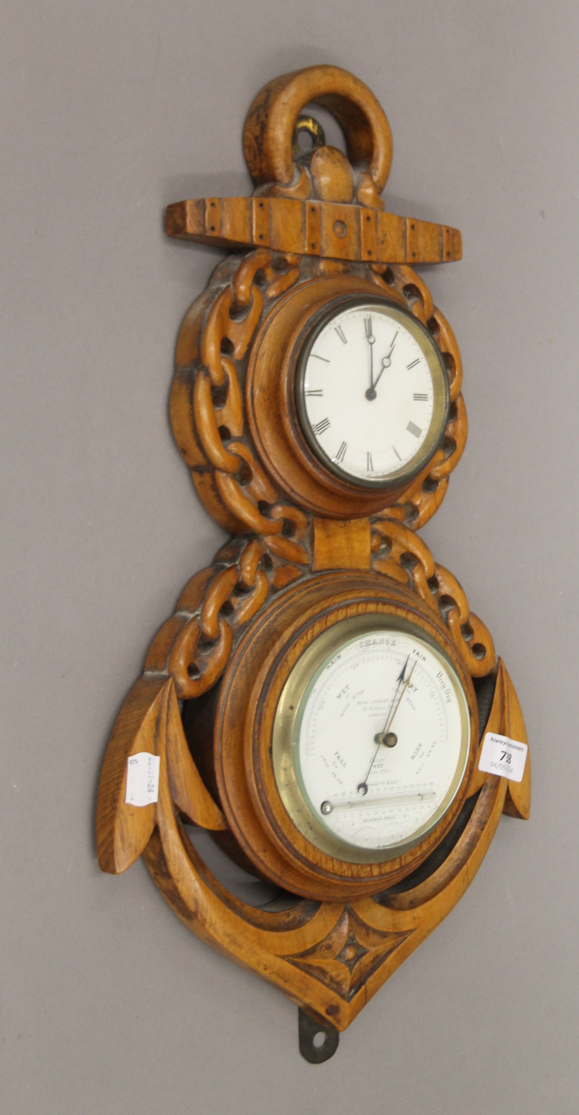A Victorian carved oak clock/barometer formed as an anchor. 50 cm high.