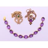 Two Edwardian pendant necklaces, one on a 9 ct gold chain, and a gilt metal and amethyst bracelet.