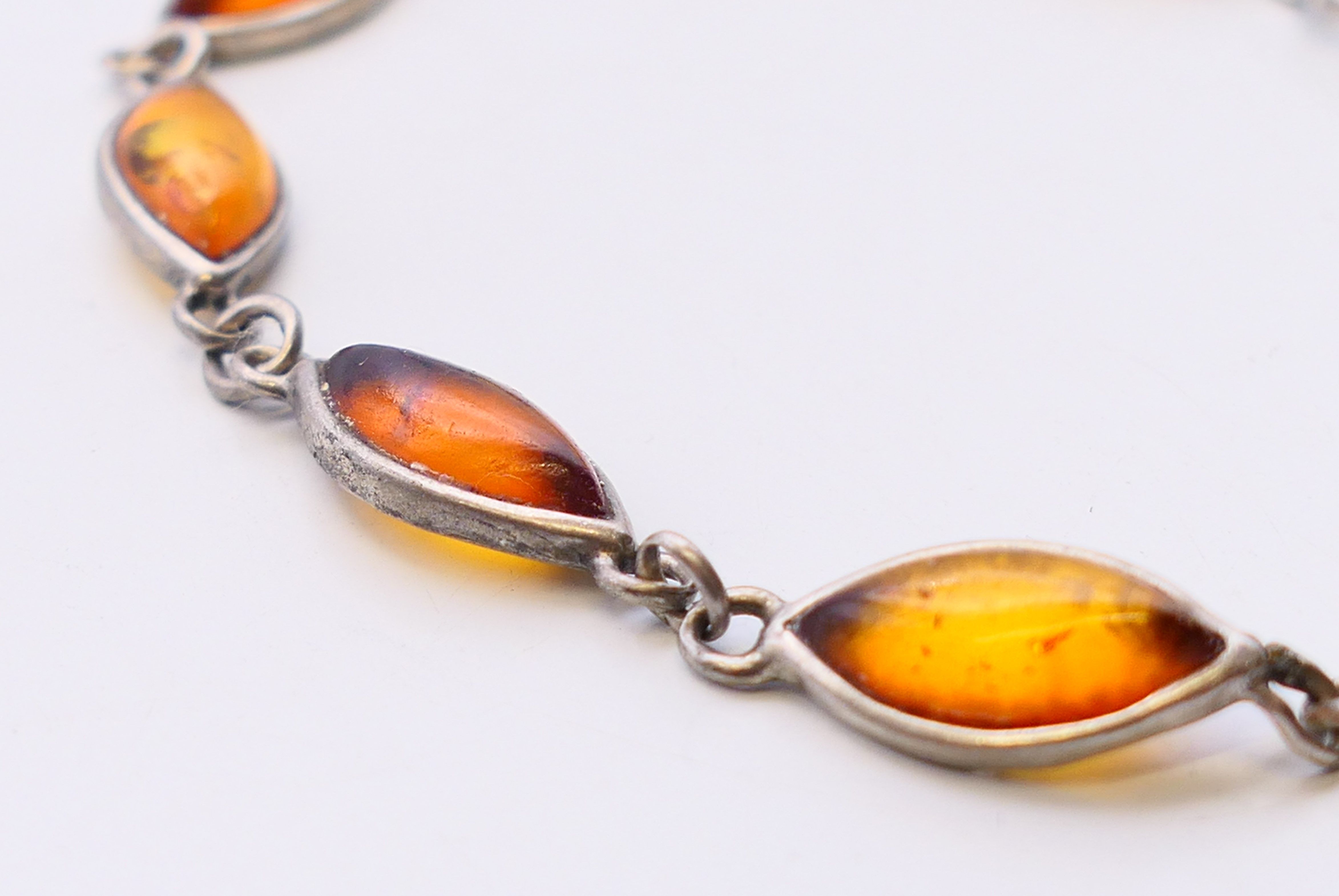 A collection of silver jewellery, including amber and pendants. - Image 14 of 18