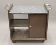 A granite-topped industrial trolley. 110 cm long.