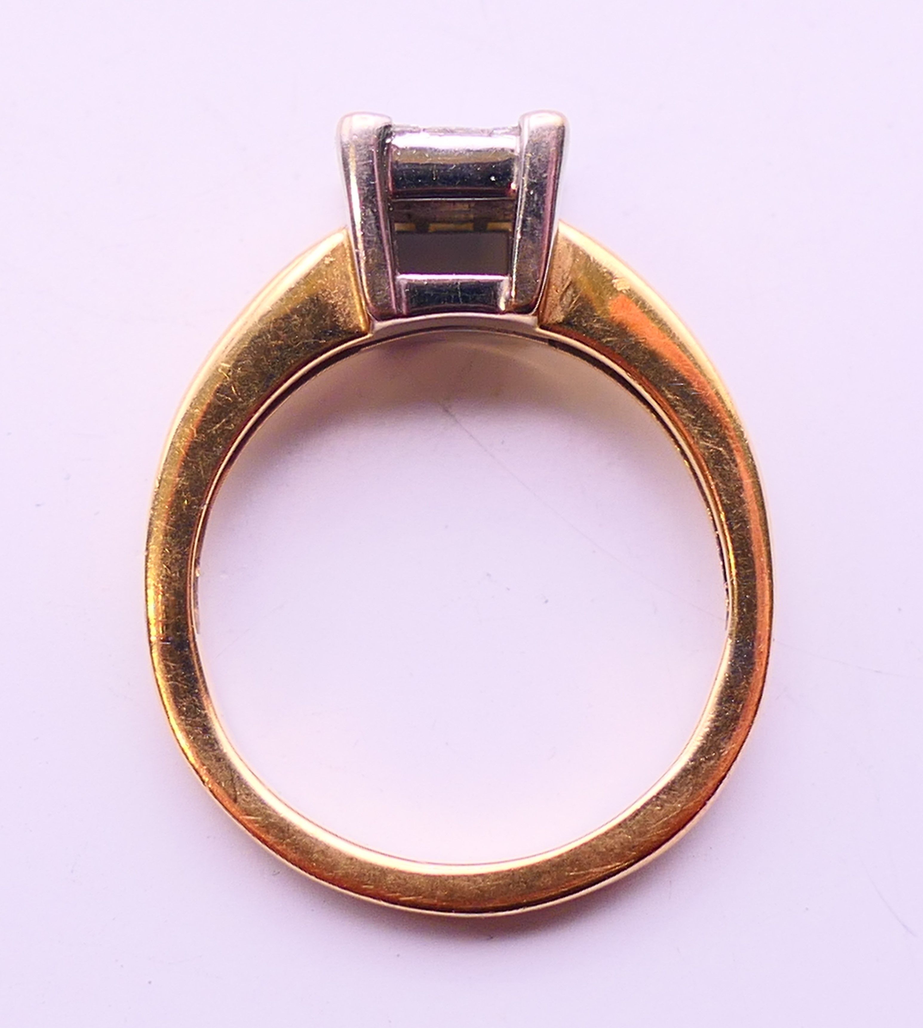 An 18 ct gold ring set with nine diamonds. together with a copy of a 2012 insurance valuation. - Image 7 of 8
