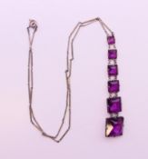 An Art Deco necklace. 40 cm long, pendant 7 cm high.