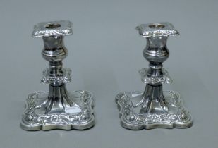 A pair of silver candlesticks. 13 cm high.