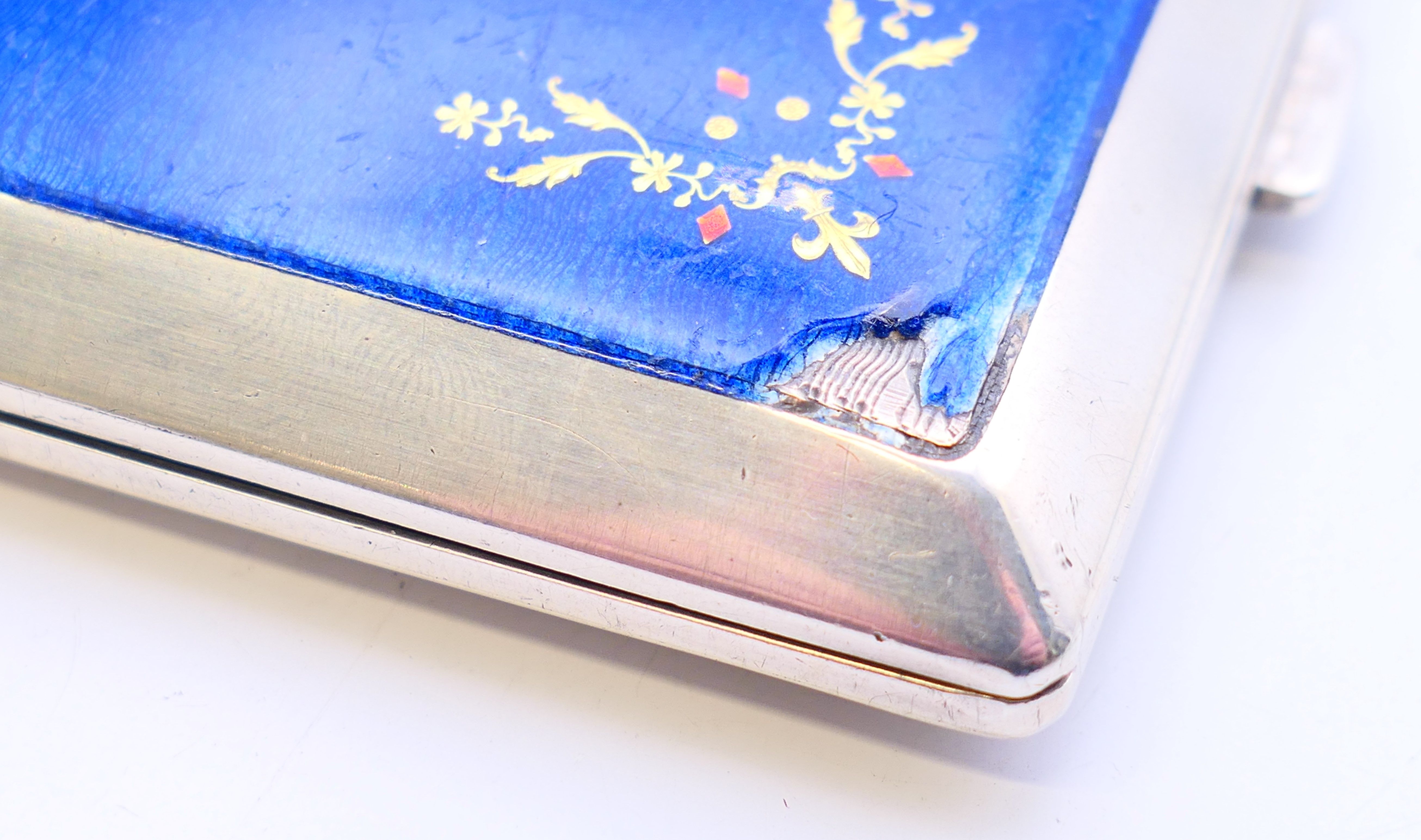 A continental silver and blue enamel cigarette case. 10 cm x 8 cm. - Image 4 of 8