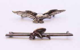 Two silver brooches, one formed as an eagle, the other a bar brooch with a pixie. Pixie brooch 5.