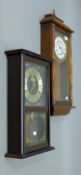 Two wall clocks. The largest 64 cm high.