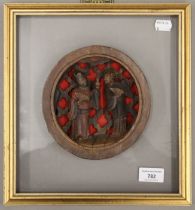 A Chinese carved wooden roundel depicting two figures mounted in a frame. 28 x 30.5 cm overall.