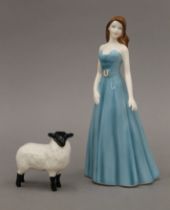 A boxed Royal Doulton figurine (Aquarius HN 5338) and a boxed Beswick black faced lamb.