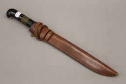 A German dagger in a leather sheath. 44 cm long.