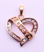 A 9 ct gold and diamond set 'I Love You' heart shaped pendant. 2.2 grammes. 2 cm high.