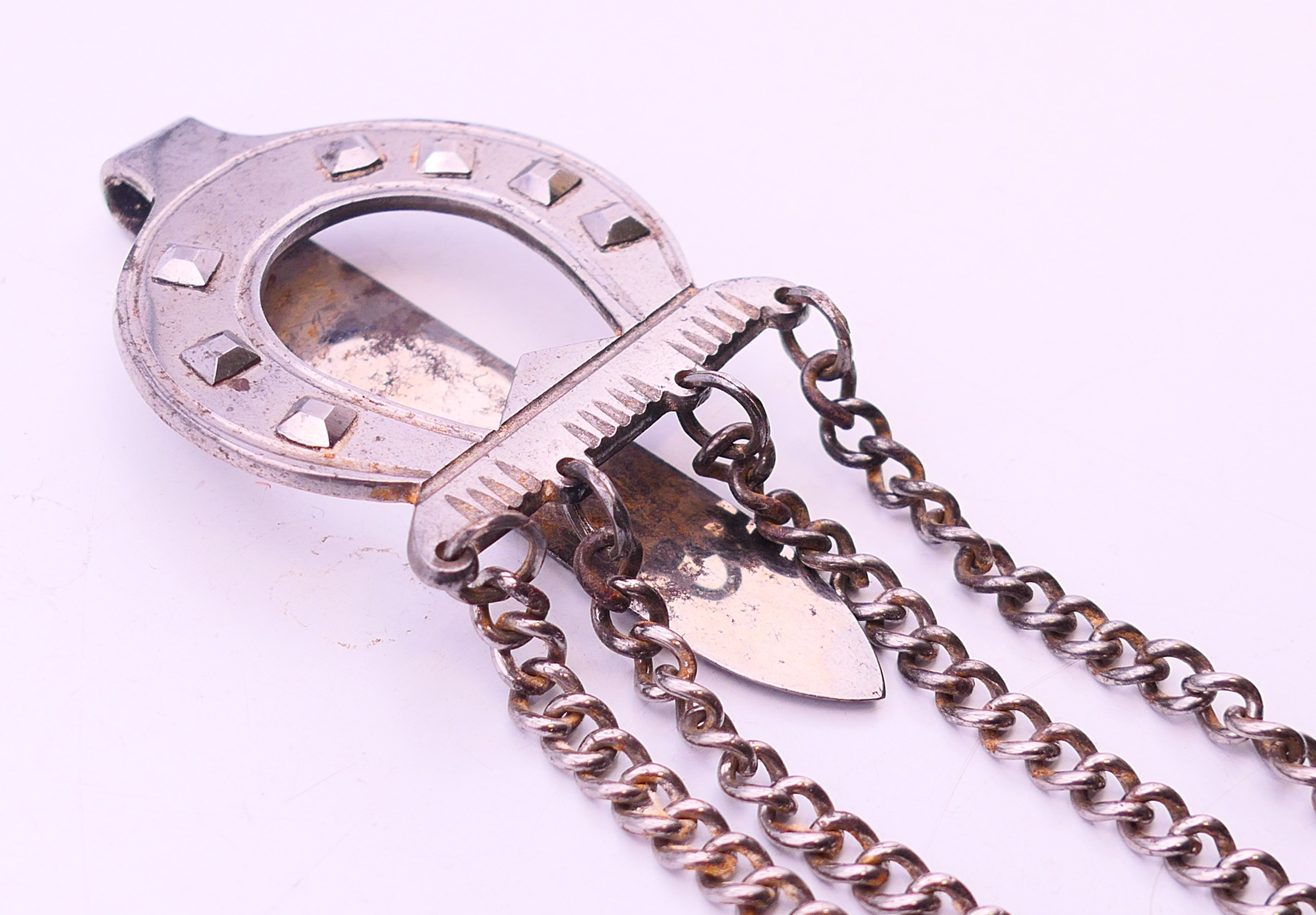 A 19th century steel chatelaine consisting of four implements on chains leading to a horseshoe - Image 2 of 4