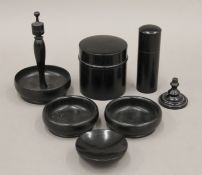An ebony dressing table set. The largest piece 10 cm high.